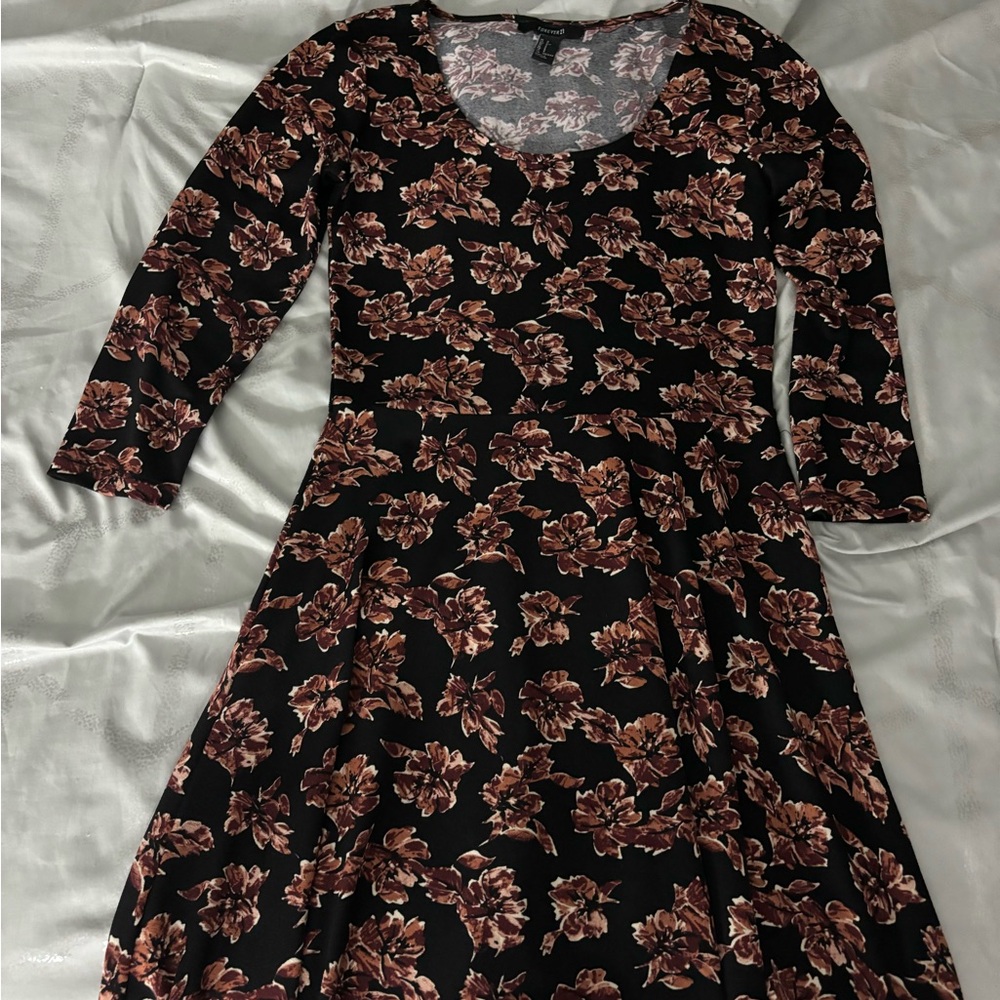 Forever 21 black and floral dress with 3/4 sleeves. Size S.